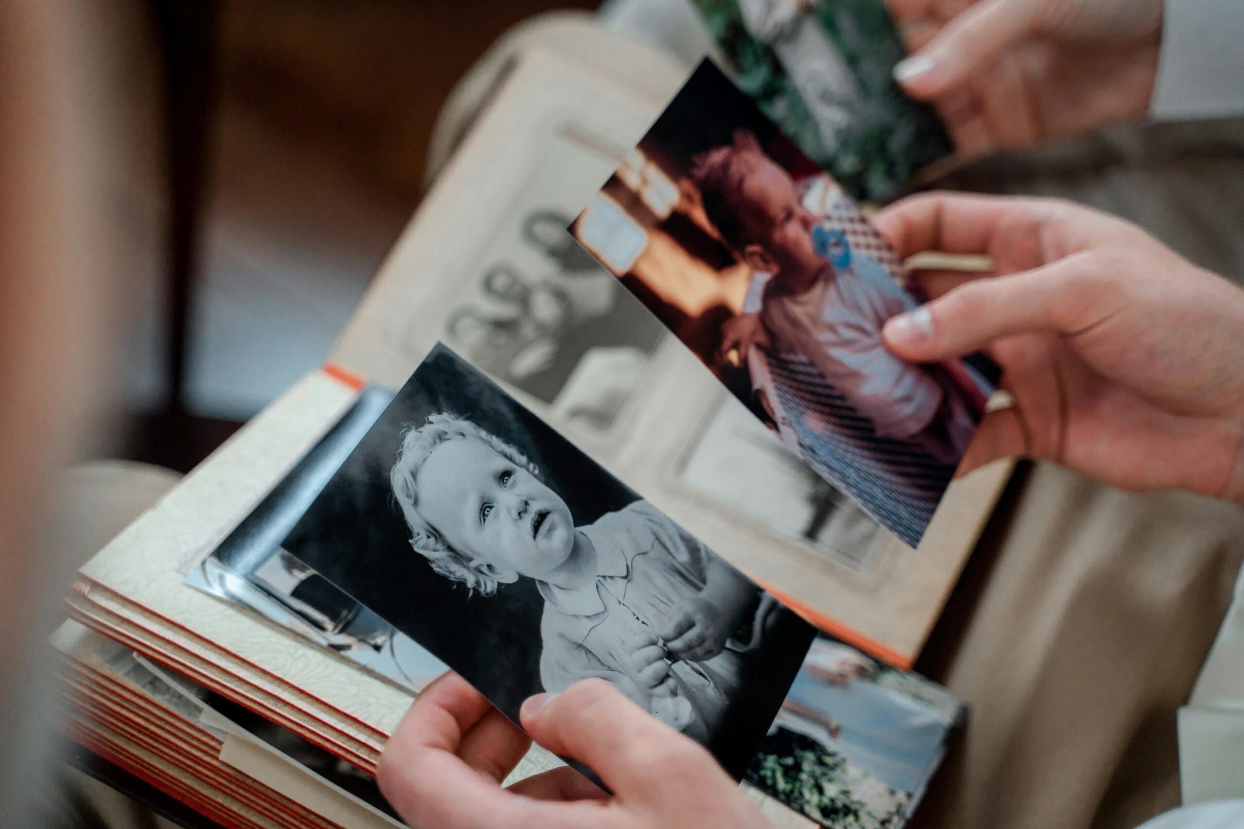 elderly woman looking at old photos elderly woman looking at old photos