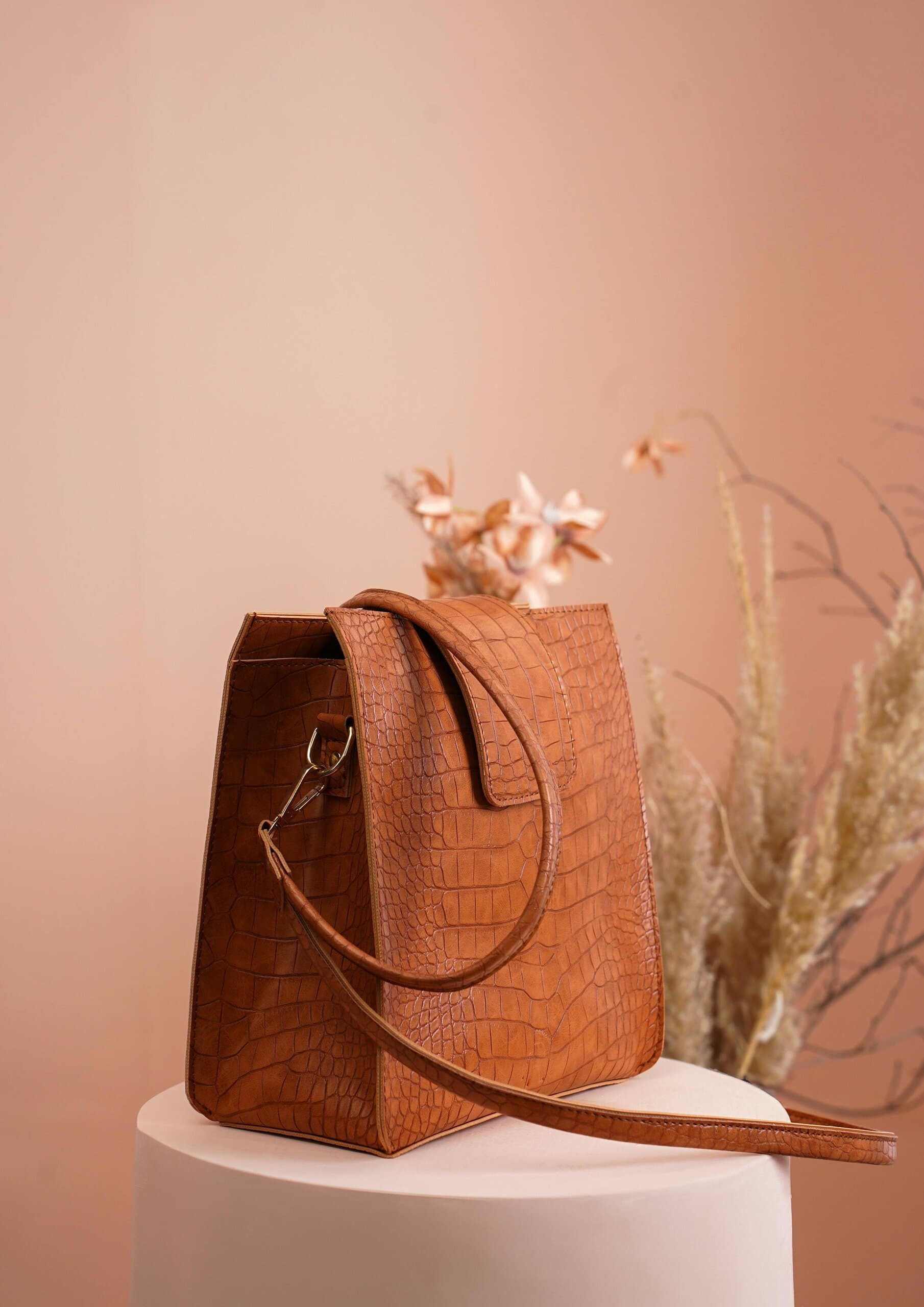 woman holding handbag product woman holding handbag product